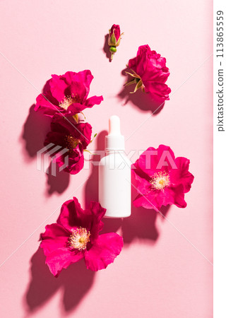 Beauty concept with cosmetic bottle and flowers Beauty concept with cosmetic bottle and flowers 113865559