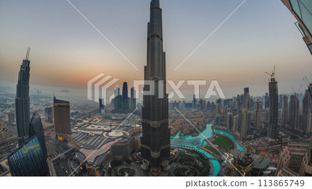 Panoramic skyline view of Dubai downtown during sunrise with mall, fountains and Burj Khalifa aerial morning timelapse Panoramic skyline view of Dubai downtown during sunrise with mall, fountains and Burj Khalifa aerial morning timelapse 113865749