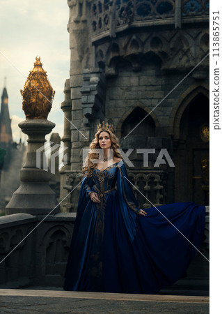 Queen in blue medieval dress by castle Queen in blue medieval dress by castle 113865751