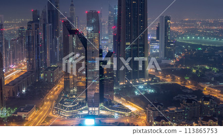 Dubai International Financial Centre district with modern skyscrapers night to day timelapse 113865753