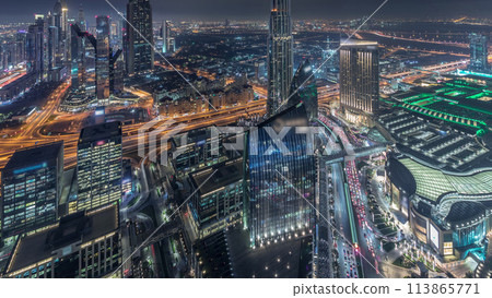 Dubai International Financial Centre district with modern skyscrapers night timelapse 113865771