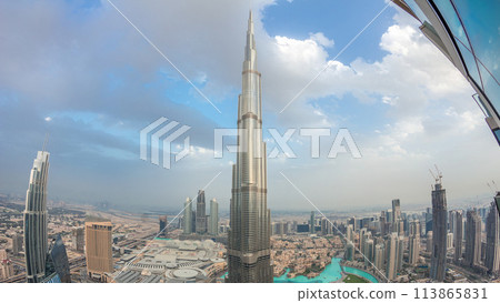 Panoramic skyline view of Dubai downtown with mall, fountains and Burj Khalifa aerial day to night timelapse Panoramic skyline view of Dubai downtown with mall, fountains and Burj Khalifa aerial day to night timelapse 113865831