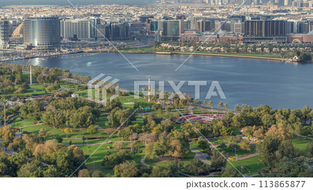 Aerial view of beautiful park and canal in Dubai city, United Arab Emirates Timelapse Aerial view of beautiful park and canal in Dubai city, United Arab Emirates Timelapse 113865877