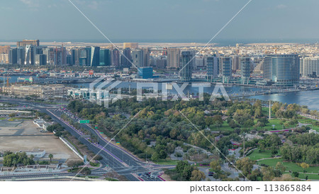Aerial view of new modern buildings and green park in Dubai city, United Arab Emirates Timelapse Aerial Aerial view of new modern buildings and green park in Dubai city, United Arab Emirates Timelapse Aerial 113865884