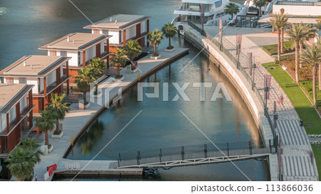 Small houses near canal in Dubai, UAE aerial timelapse 113866036