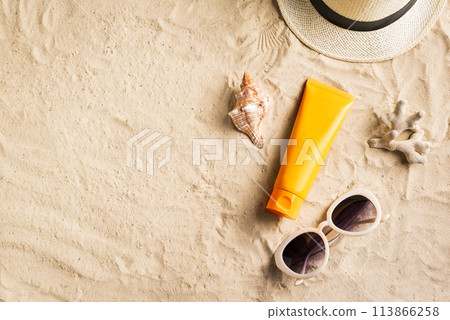 Sunscreen sunblock lotion on sandy beach Sunscreen sunblock lotion on sandy beach 113866258