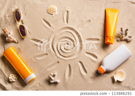 Sunblock products on sandy beach Sunblock products on sandy beach 113866291