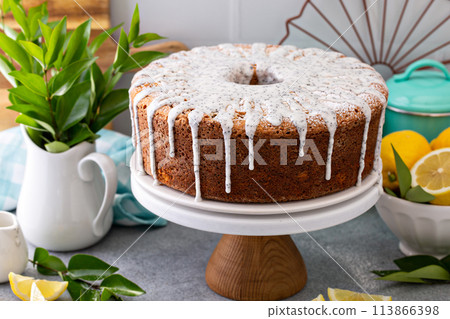 Lemon poppy seed pound cake, whole bundt cake drizzled with icing 113866398