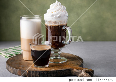 Variety of coffee drinks on green background, Irish coffee Variety of coffee drinks on green background, Irish coffee 113866529