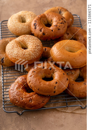 Variety of bagels freshly baked for breakfast 113866571