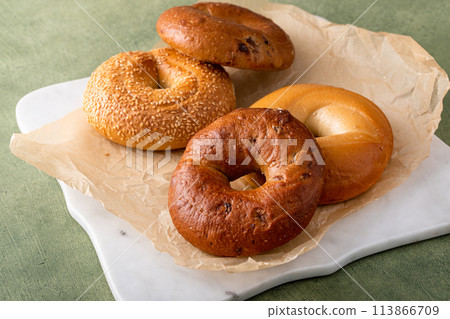 Variety of bagels freshly baked for breakfast 113866709