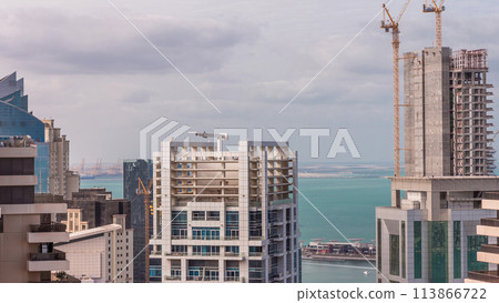 Modern buildings on Dubai Marina and JBR with construction site aerial timelapse in Dubai, United Arab Emirates Modern buildings on Dubai Marina and JBR with construction site aerial timelapse in Dubai, United Arab Emirates 113866722