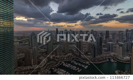 Dubai Marina skyscrapers and jumeirah lake towers view from the top aerial timelapse in the United Arab Emirates. 113866727