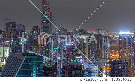 Dubai Marina skyscrapers and jumeirah lake towers view from the top aerial night timelapse in the United Arab Emirates. Dubai Marina skyscrapers and jumeirah lake towers view from the top aerial night timelapse in the United Arab Emirates. 113866736