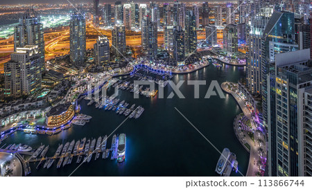 Dubai Marina skyscrapers and jumeirah lake towers view from the top aerial night timelapse in the United Arab Emirates. 113866744