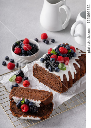 Chocolate cake with cream cheese frosting and fresh berries Chocolate cake with cream cheese frosting and fresh berries 113866881