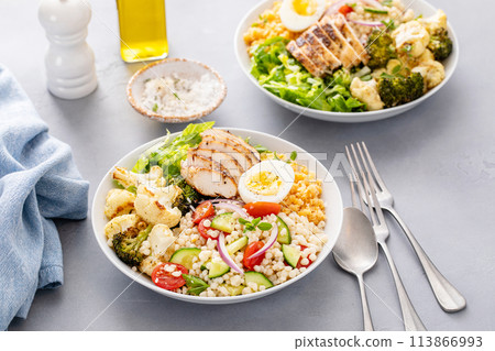 Healthy lunch bowl with grilled chicken, roasted vegetables, fresh lettuce, cooked lentils, salad and boiled egg Healthy lunch bowl with grilled chicken, roasted vegetables, fresh lettuce, cooked lentils, salad and boiled egg 113866993