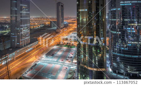 Office buildings in Jumeirah lake towers district night timelapse in Dubai Office buildings in Jumeirah lake towers district night timelapse in Dubai 113867052