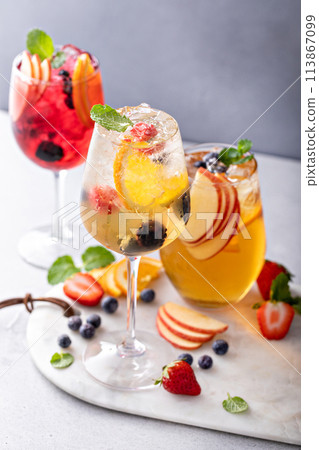White wine sangria with fruits and berries White wine sangria with fruits and berries 113867099
