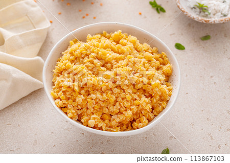 Cooked red lentils in a bowl, healthy vegan protein source Cooked red lentils in a bowl, healthy vegan protein source 113867103