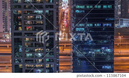 Residential and office buildings in Jumeirah lake towers district night timelapse in Dubai 113867104