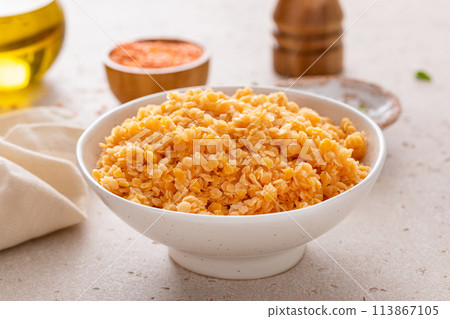 Cooked red lentils in a bowl, healthy vegan protein source 113867105