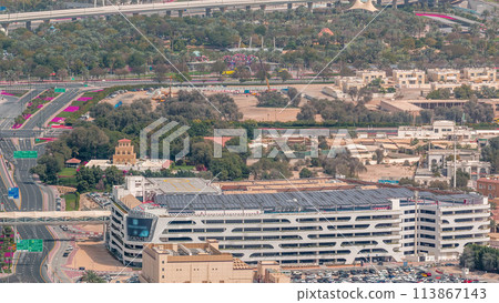 Car parking lot viewed from above timelapse, Aerial top view. Dubai, UAE 113867143