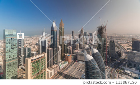 Skyline view of the buildings of Sheikh Zayed Road and DIFC aerial timelapse in Dubai, UAE. 113867150