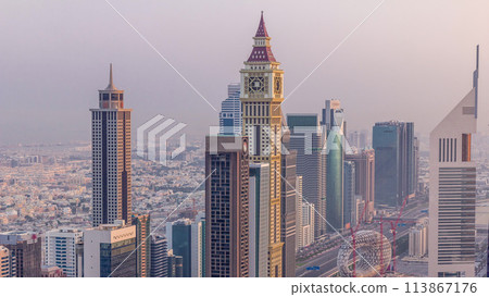 Skyline view of the buildings of Sheikh Zayed Road and DIFC aerial timelapse in Dubai, UAE. Skyline view of the buildings of Sheikh Zayed Road and DIFC aerial timelapse in Dubai, UAE. 113867176