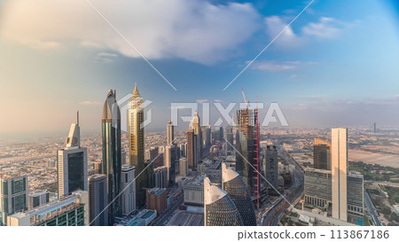 Skyline view of the buildings of Sheikh Zayed Road and DIFC aerial timelapse in Dubai, UAE. 113867186
