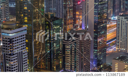 Skyline of the buildings of Sheikh Zayed Road and DIFC aerial night timelapse in Dubai, UAE. Skyline of the buildings of Sheikh Zayed Road and DIFC aerial night timelapse in Dubai, UAE. 113867189