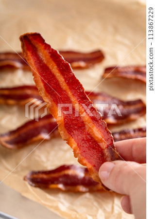 Turkey bacon cooked on parchment paper Turkey bacon cooked on parchment paper 113867229
