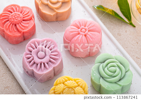 Traditional Chinese snow skin mooncakes for mid autumn festival with fruit, taro and matcha filling Traditional Chinese snow skin mooncakes for mid autumn festival with fruit, taro and matcha filling 113867241