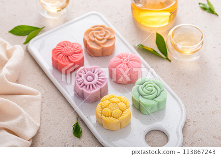 Traditional Chinese snow skin mooncakes for mid autumn festival with fruit, taro and matcha filling 113867243