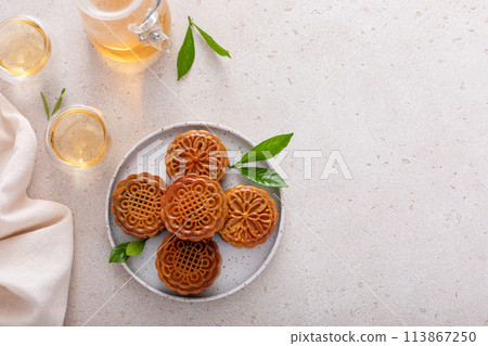 Traditional Chinese mooncakes for mid autumn festival with egg yolk and bean paste filling Traditional Chinese mooncakes for mid autumn festival with egg yolk and bean paste filling 113867250