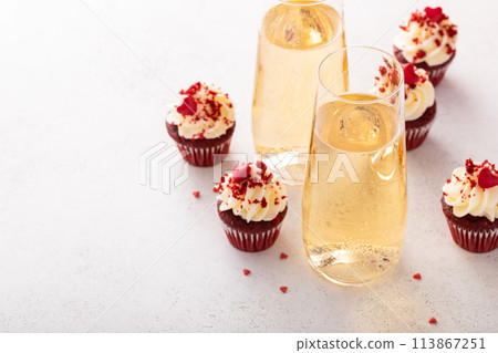 Champagne for Valentines day served with red velvet cupcakes Champagne for Valentines day served with red velvet cupcakes 113867251