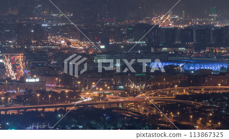 Aerial view of neighborhood Deira and Dubai creek with typical old and modern buildings night timelapse. Aerial view of neighborhood Deira and Dubai creek with typical old and modern buildings night timelapse. 113867325
