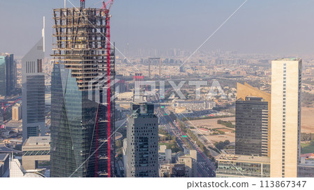 Skyline view of the buildings of Sheikh Zayed Road and DIFC aerial timelapse in Dubai, UAE. 113867347
