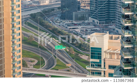 Aerial view of a road intersection in a big city timelapse. 113867368