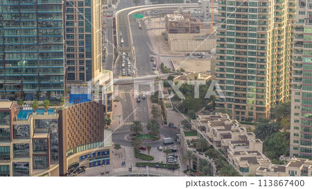 Aerial view of a road intersection in a big city timelapse. 113867400