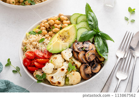 Healthy vegan lunch bowl with high protein food, cooked mushrooms, chickpeas and quinoa Healthy vegan lunch bowl with high protein food, cooked mushrooms, chickpeas and quinoa 113867562