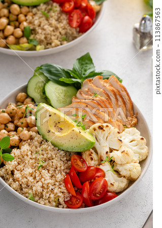 Healthy high protein lunch bowl with grilled chicken, roasted cauliflower, chickpeas and quinoa Healthy high protein lunch bowl with grilled chicken, roasted cauliflower, chickpeas and quinoa 113867563
