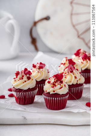 Red velvet cupcakes with cream cheese frosting for Valentines day Red velvet cupcakes with cream cheese frosting for Valentines day 113867564