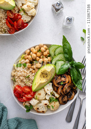 Healthy high protein vegan plant based lunch bowl with mushrooms, roasted cauliflower, chickpeas and quinoa 113867586