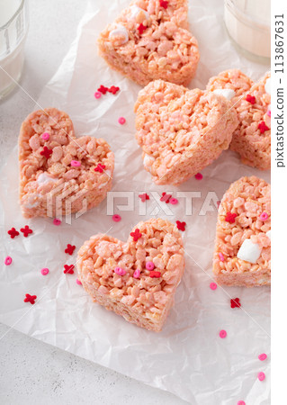 Pink heart shaped rice krispie treats served with milk Pink heart shaped rice krispie treats served with milk 113867631