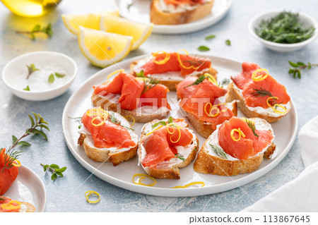 Smoked salmon crostini with cream cheese, dill and lemon zest Smoked salmon crostini with cream cheese, dill and lemon zest 113867645