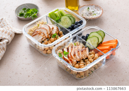 Meal prep containers with healthy food prepped, cooked chicken, quinoa, chickpeas and eggs 113867663