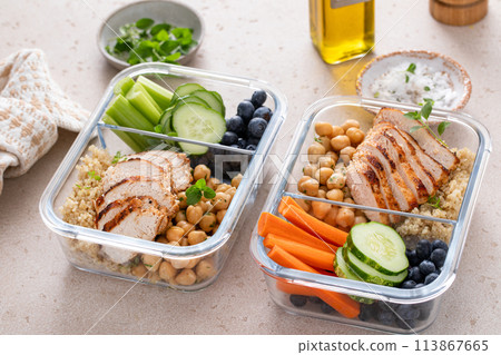 High protein healthy lunch meal prep in containers with chicken, quinoa, herbed chickpeas, vegetables and eggs High protein healthy lunch meal prep in containers with chicken, quinoa, herbed chickpeas, vegetables and eggs 113867665