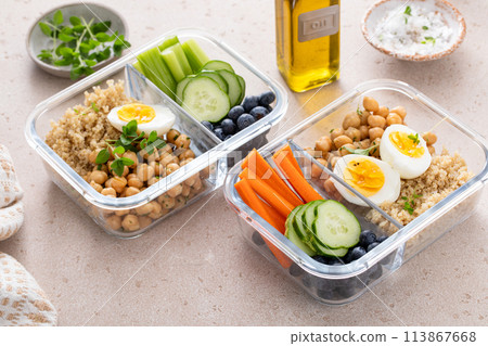 Vegetarian lunch meal prep containers high protein with quinoa, herbed chickpeas, vegetables and eggs Vegetarian lunch meal prep containers high protein with quinoa, herbed chickpeas, vegetables and eggs 113867668