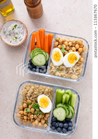 Vegetarian lunch meal prep containers high protein with quinoa, herbed chickpeas, vegetables and eggs Vegetarian lunch meal prep containers high protein with quinoa, herbed chickpeas, vegetables and eggs 113867670